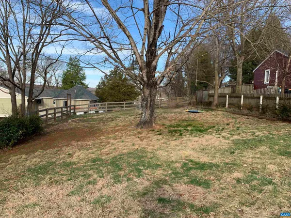 a view of a yard with trees