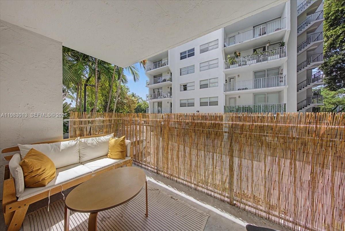 777 Northeast 62nd Street, Unit C211 Miami, FL 33138 - Photo 13 of 22 a view of balcony with couch