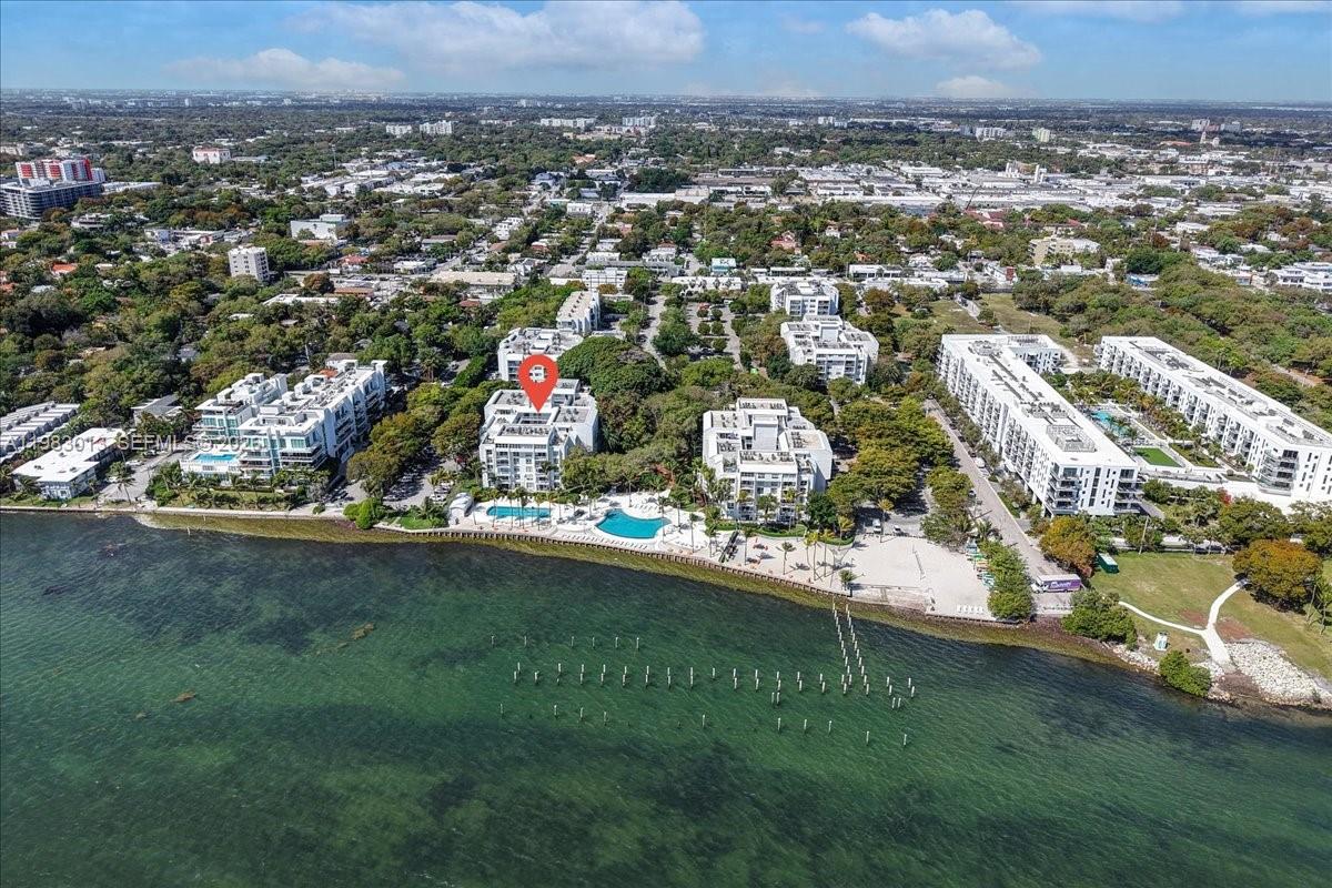 777 Northeast 62nd Street, Unit C211 Miami, FL 33138 - Photo 20 of 22 an aerial view of residential houses with outdoor space and trees