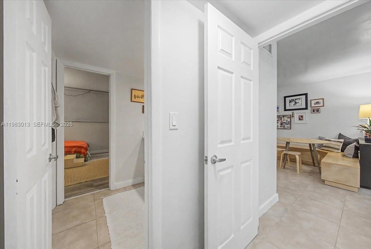 777 Northeast 62nd Street, Unit C211 Miami, FL 33138 - Photo 8 of 22 a view of a livingroom with furniture and an empty room