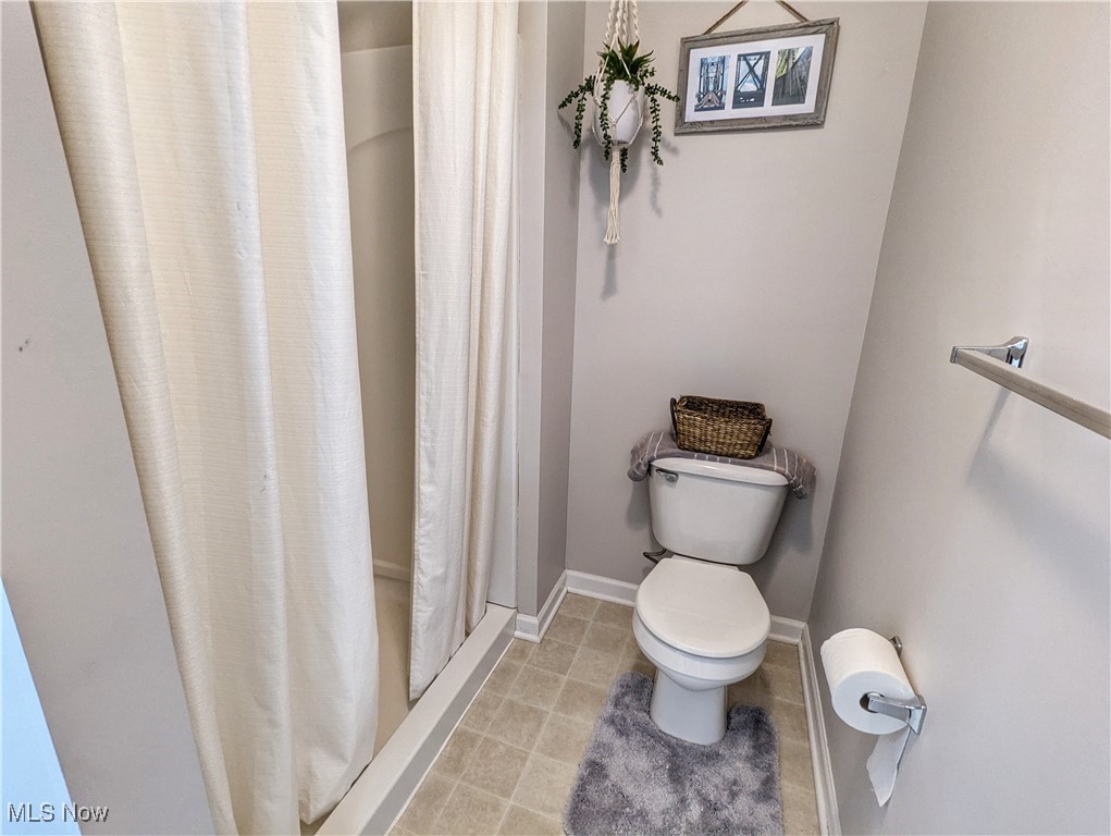 37625 Sandy Ridge Drive North Ridgeville, OH 44039 - Photo 35 of 44 Bathroom with walk in shower, toilet, and tile patterned flooring