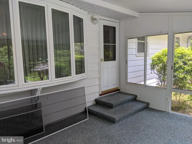 a living room with furniture and windows