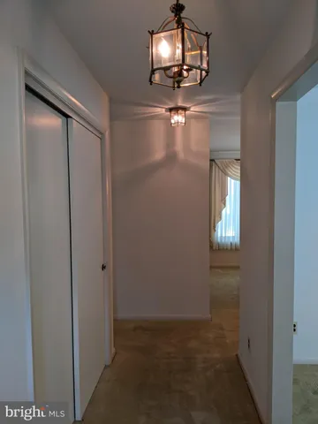 a kitchen with stainless steel appliances white cabinets and a sink