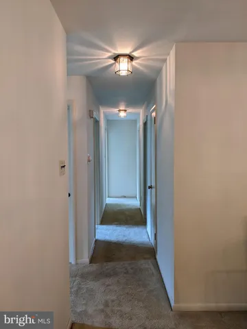 a dining room with furniture and chandelier