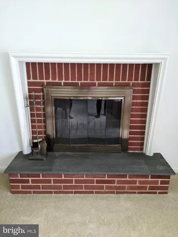 a dining room with furniture and chandelier
