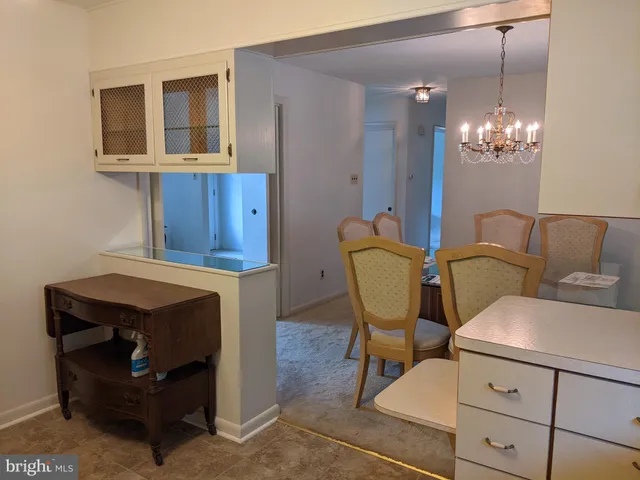 a bathroom with a sink vanity and a mirror