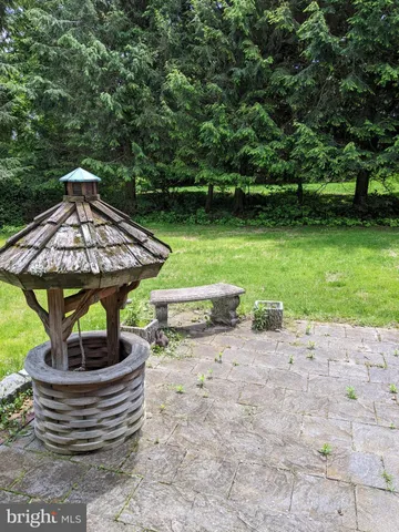 a view of a lake with a table and a chairs