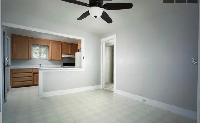 a view of a cabinet and a window in a room