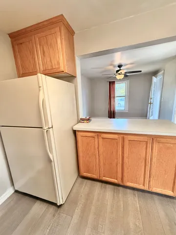 a kitchen with stainless steel appliances granite countertop a sink a stove and a microwave oven