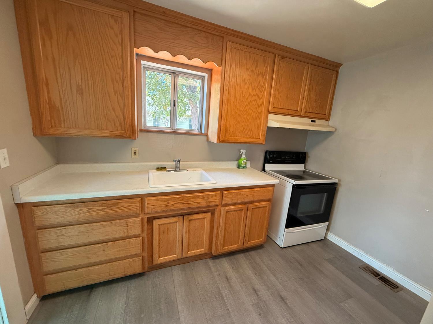 345 Fremont Street Colusa, CA 95932 - Photo 28 of 42 a kitchen with stainless steel appliances granite countertop a sink a stove and a microwave oven