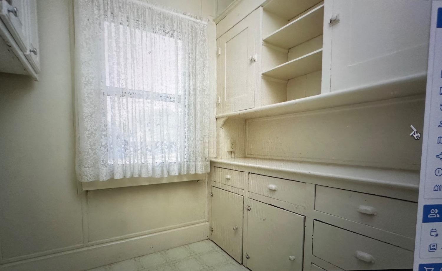 345 Fremont Street Colusa, CA 95932 - Photo 9 of 42 a view of cabinets and window in a kitchen