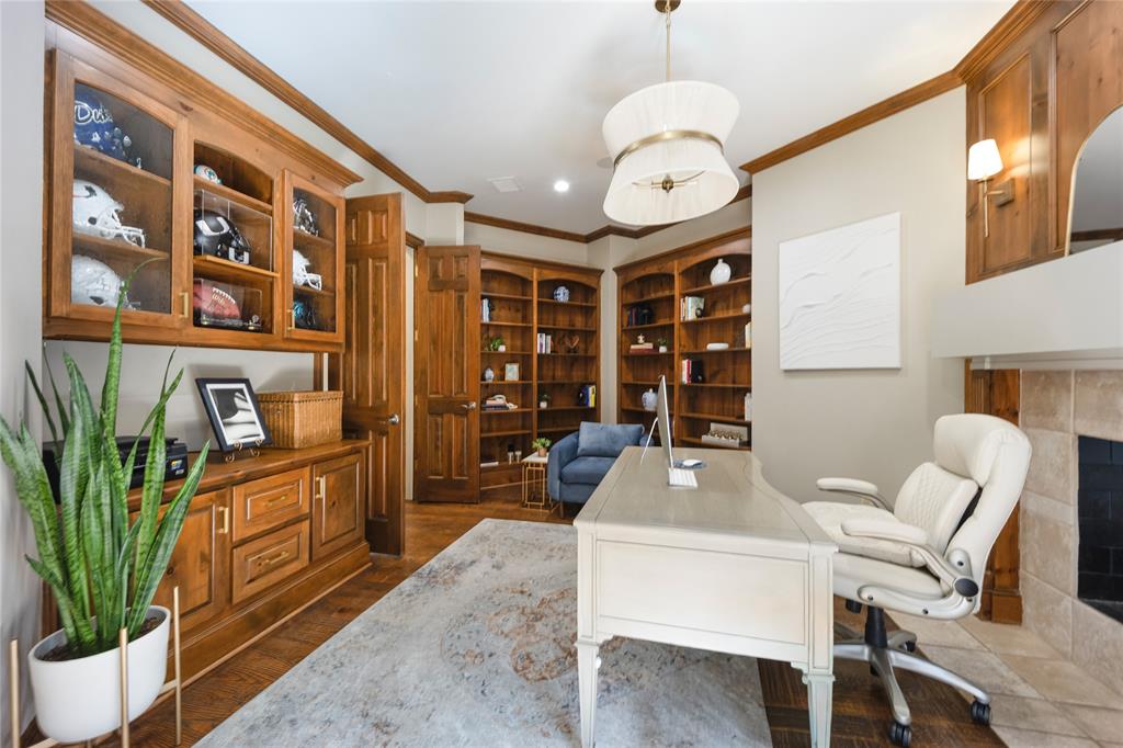6615 Meadow Road Dallas, TX 75230 - Photo 19 of 39 Handsome library with built-ins, fireplace and private terrace just through the french doors.
