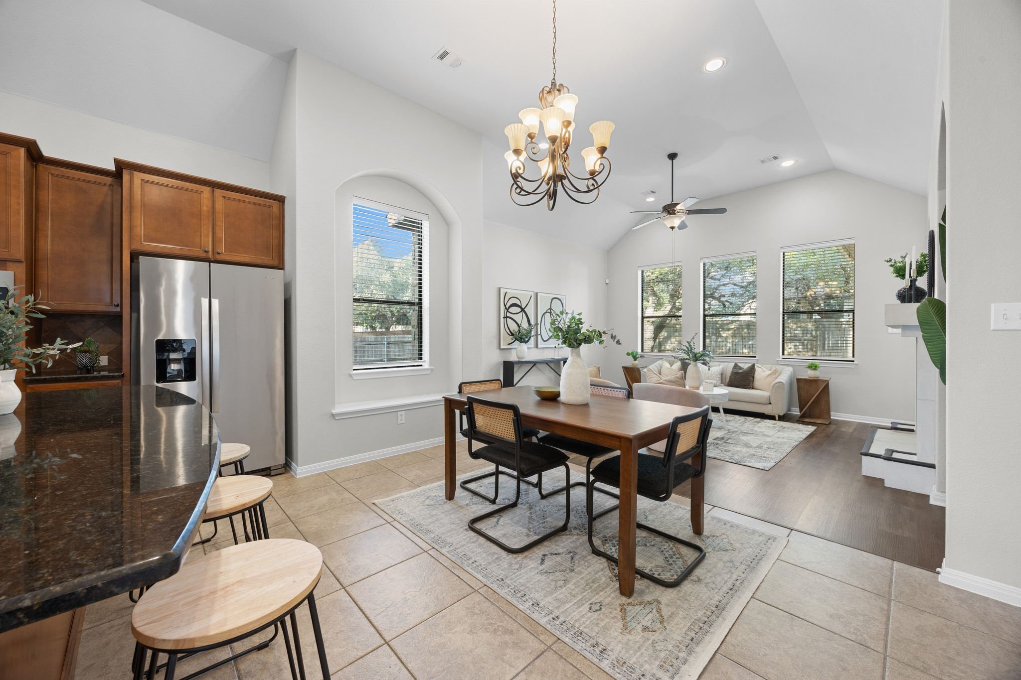 1412 Rimstone Drive Cedar Park, TX 78613 - Photo 14 of 39 a view of a dining room with furniture a chandelier and wooden floor
