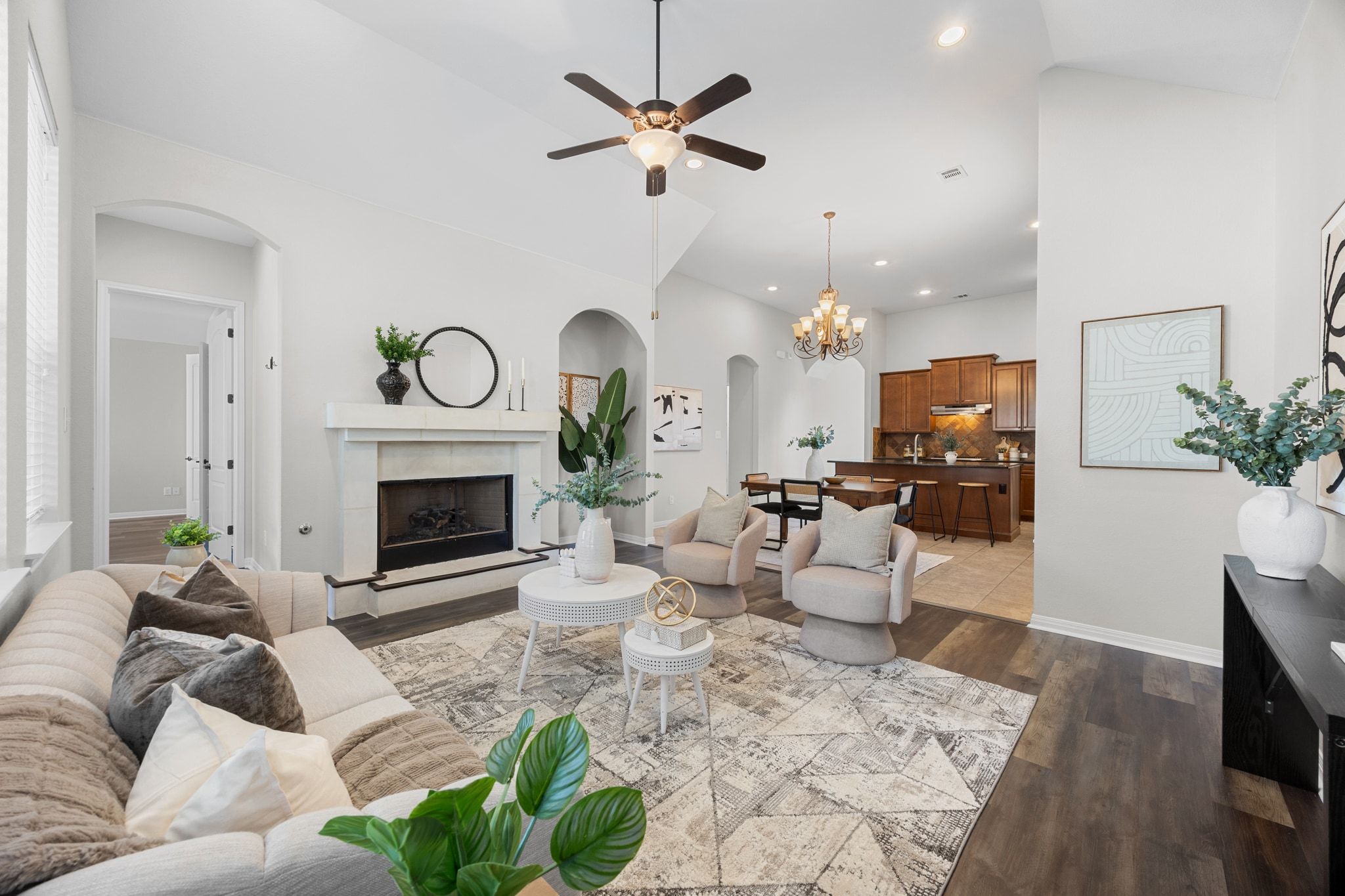 1412 Rimstone Drive Cedar Park, TX 78613 - Photo 17 of 39 a living room with furniture a fireplace and a chandelier