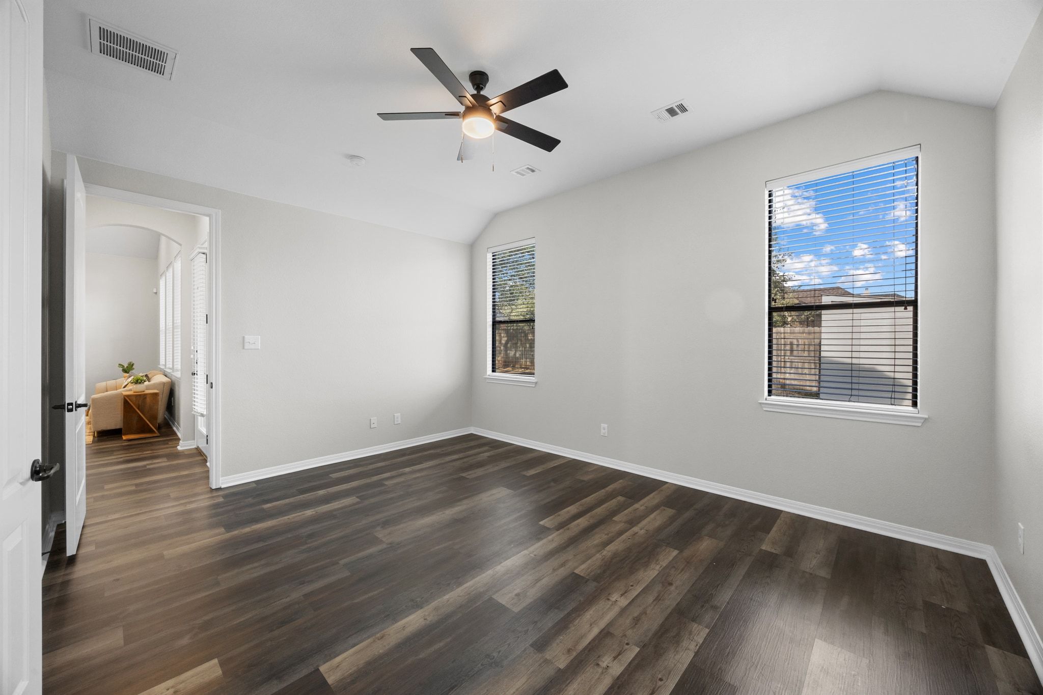 1412 Rimstone Drive Cedar Park, TX 78613 - Photo 24 of 39 a view of a livingroom with wooden floor and a ceiling fan