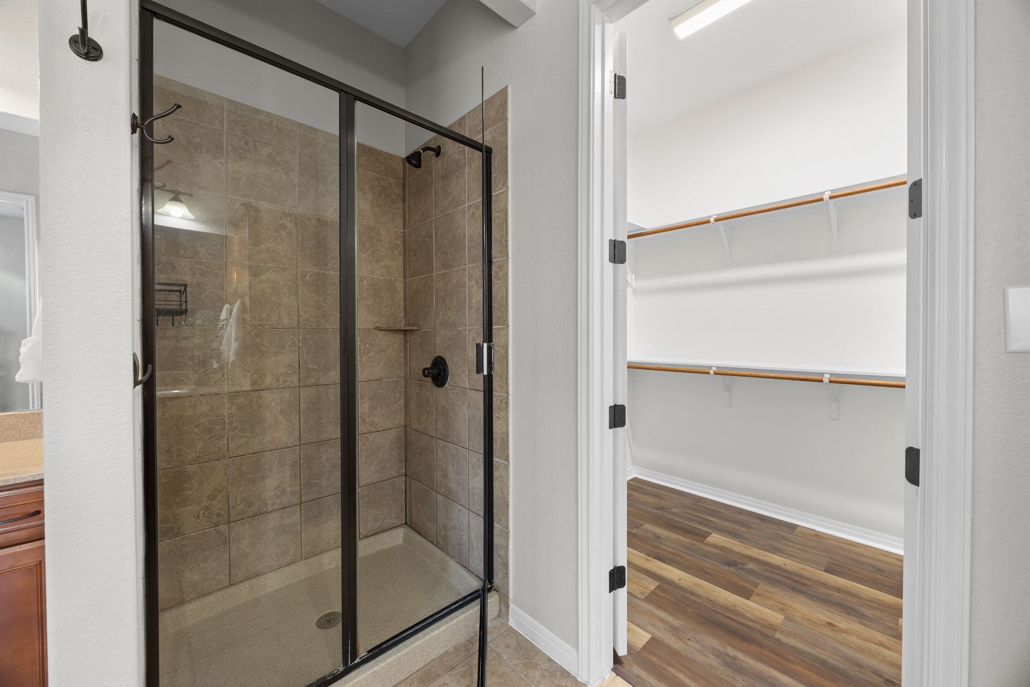 1412 Rimstone Drive Cedar Park, TX 78613 - Photo 28 of 39 a bathroom with a glass shower door