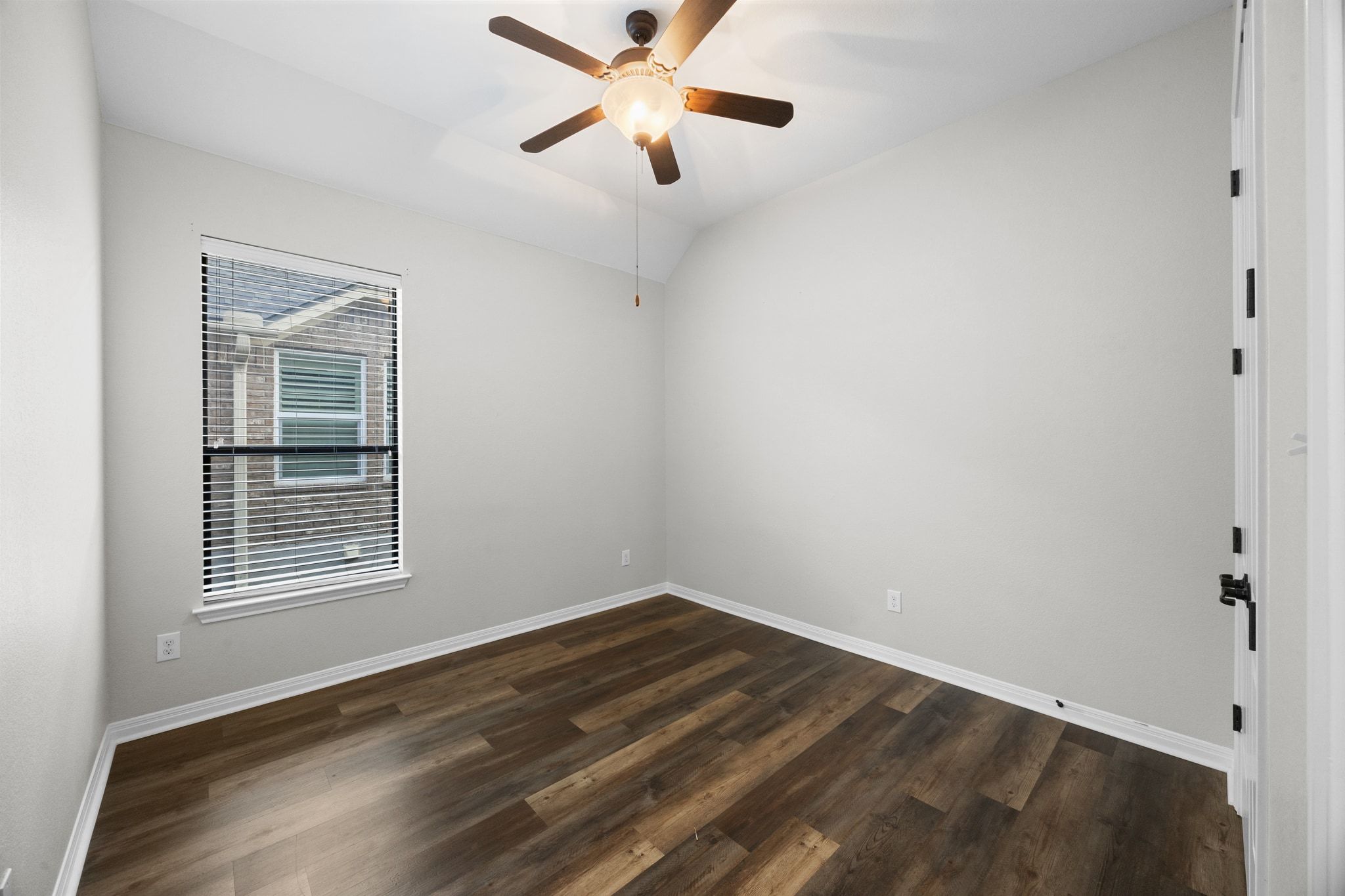 1412 Rimstone Drive Cedar Park, TX 78613 - Photo 32 of 39 a view of an empty room with wooden floor and a window