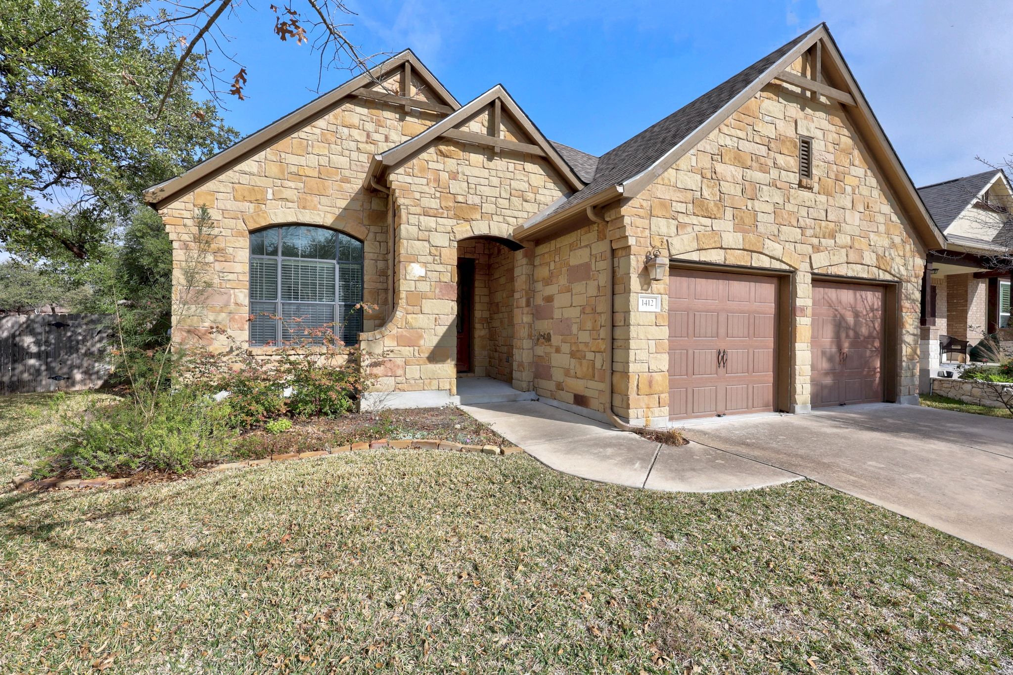 1412 Rimstone Drive Cedar Park, TX 78613 - Photo 4 of 39 a front view of a house with garden