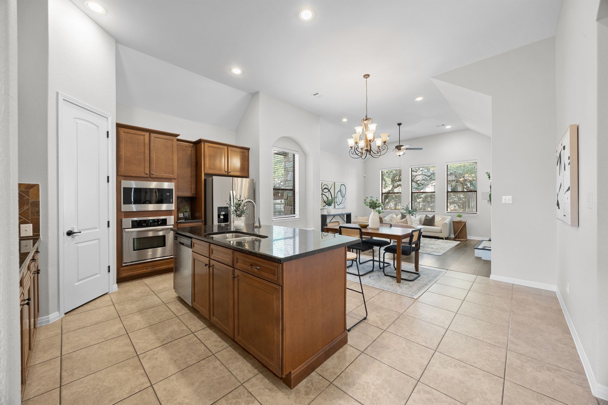 1412 Rimstone Drive Cedar Park, TX 78613 - Photo 8 of 39 a kitchen with stainless steel appliances a stove top oven and cabinets