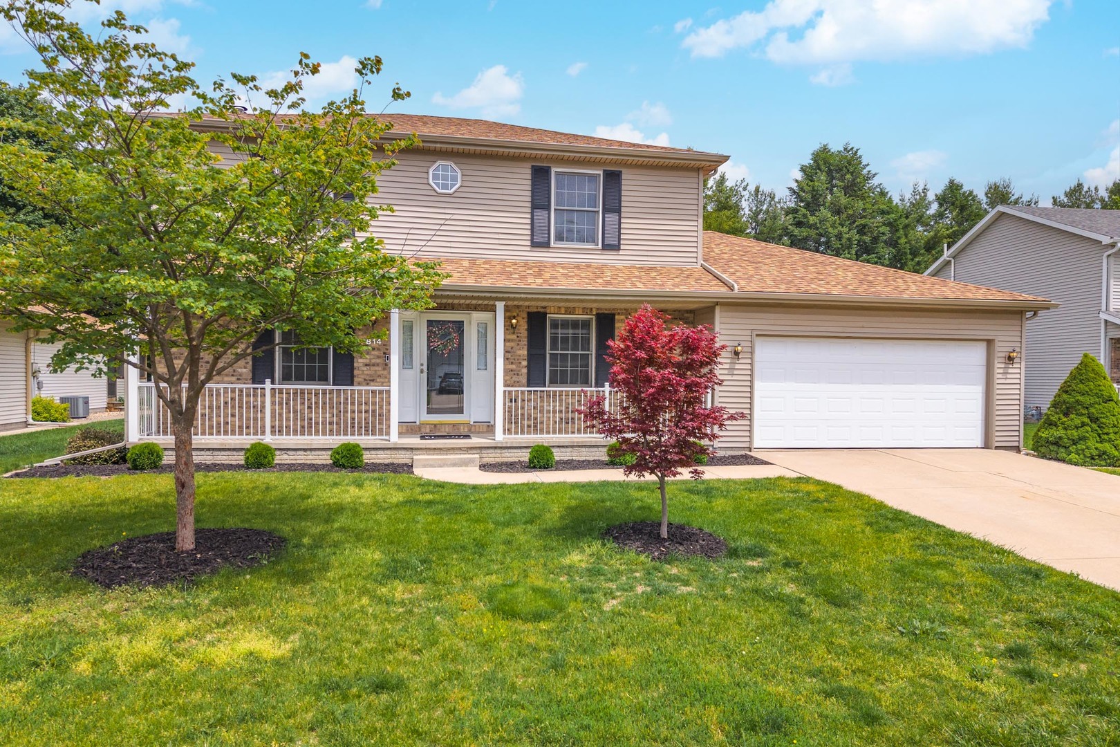 814 Landau Lane Normal, IL 61761 - Photo 2 of 58 a front view of a house with a garden and trees