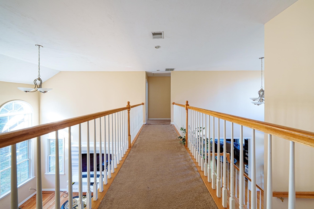 300 Crownshield Avenue Uxbridge, MA 01569 - Photo 13 of 24 a view of a hallway with wooden floor