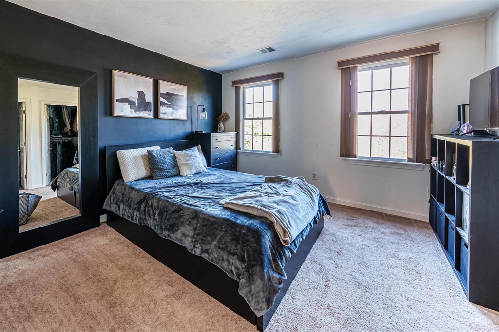 300 Crownshield Avenue Uxbridge, MA 01569 - Photo 21 of 24 a bedroom with a bed next to a window