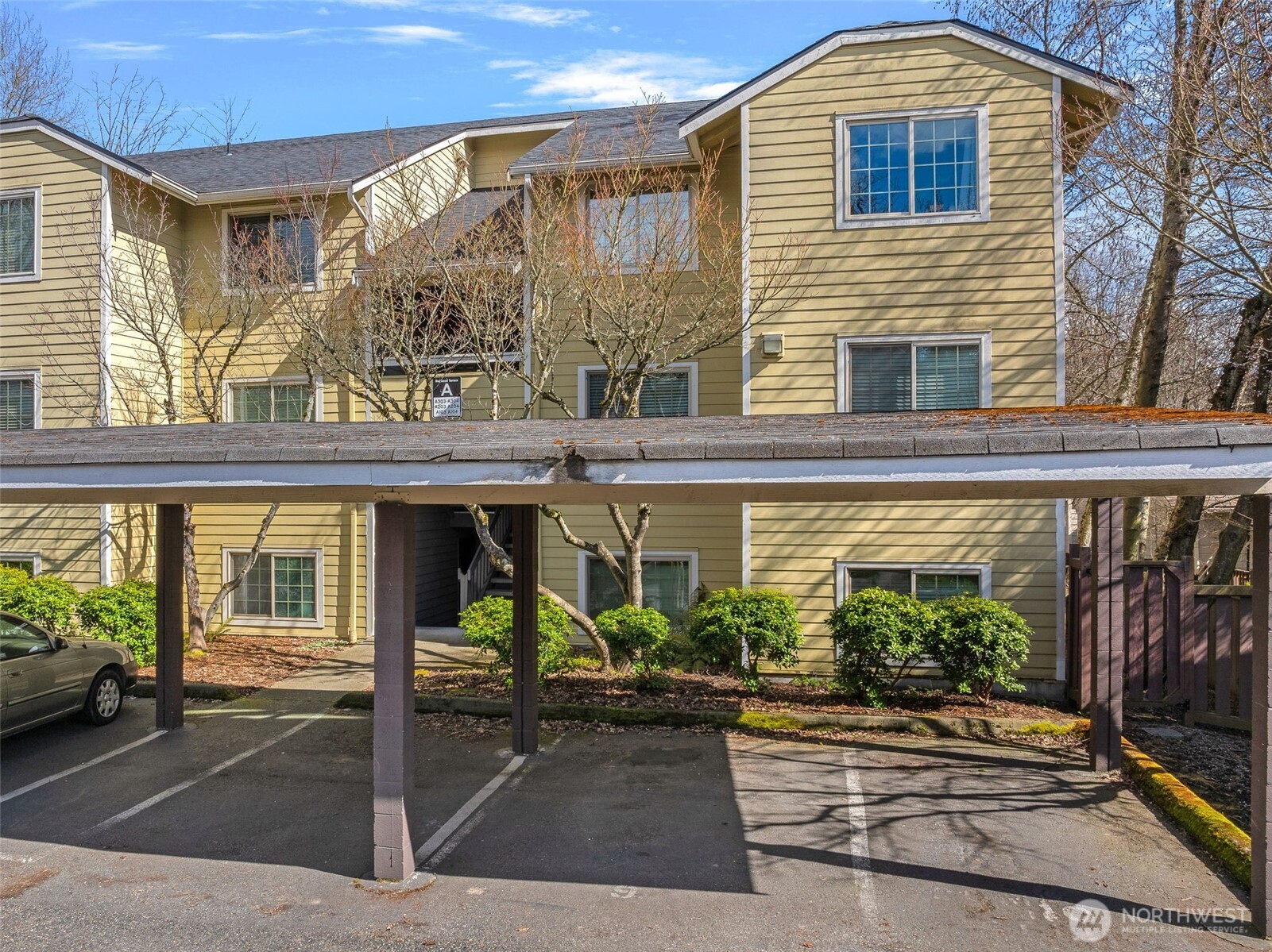 9806 28th Avenue Southwest, Unit A104 Seattle, WA 98126 - Photo 1 of 25 a front view of a house with garden