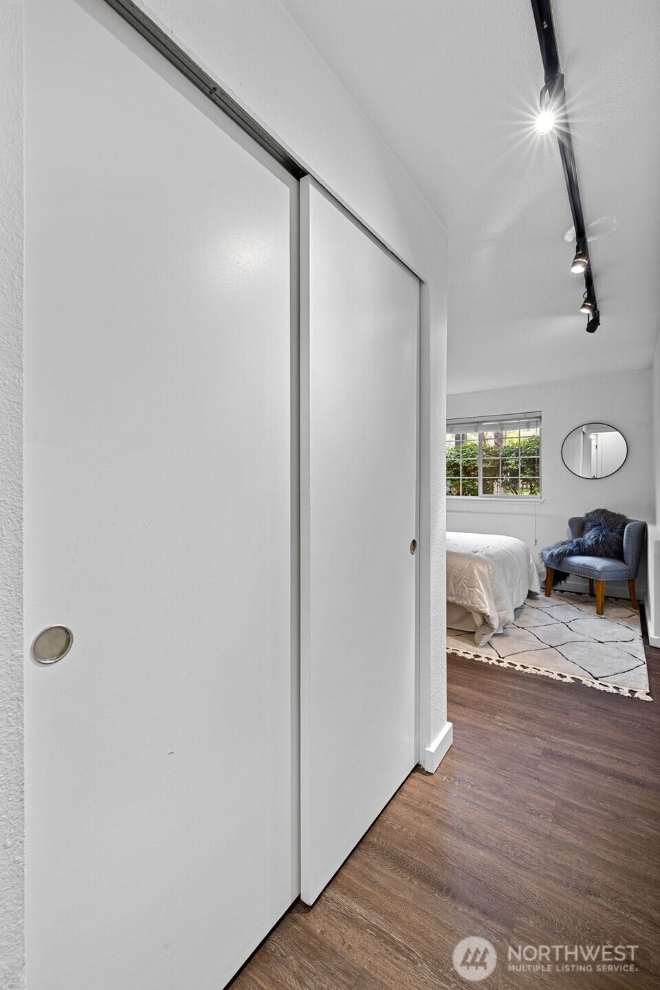 9806 28th Avenue Southwest, Unit A104 Seattle, WA 98126 - Photo 15 of 25 a view of a living room and hardwood floor