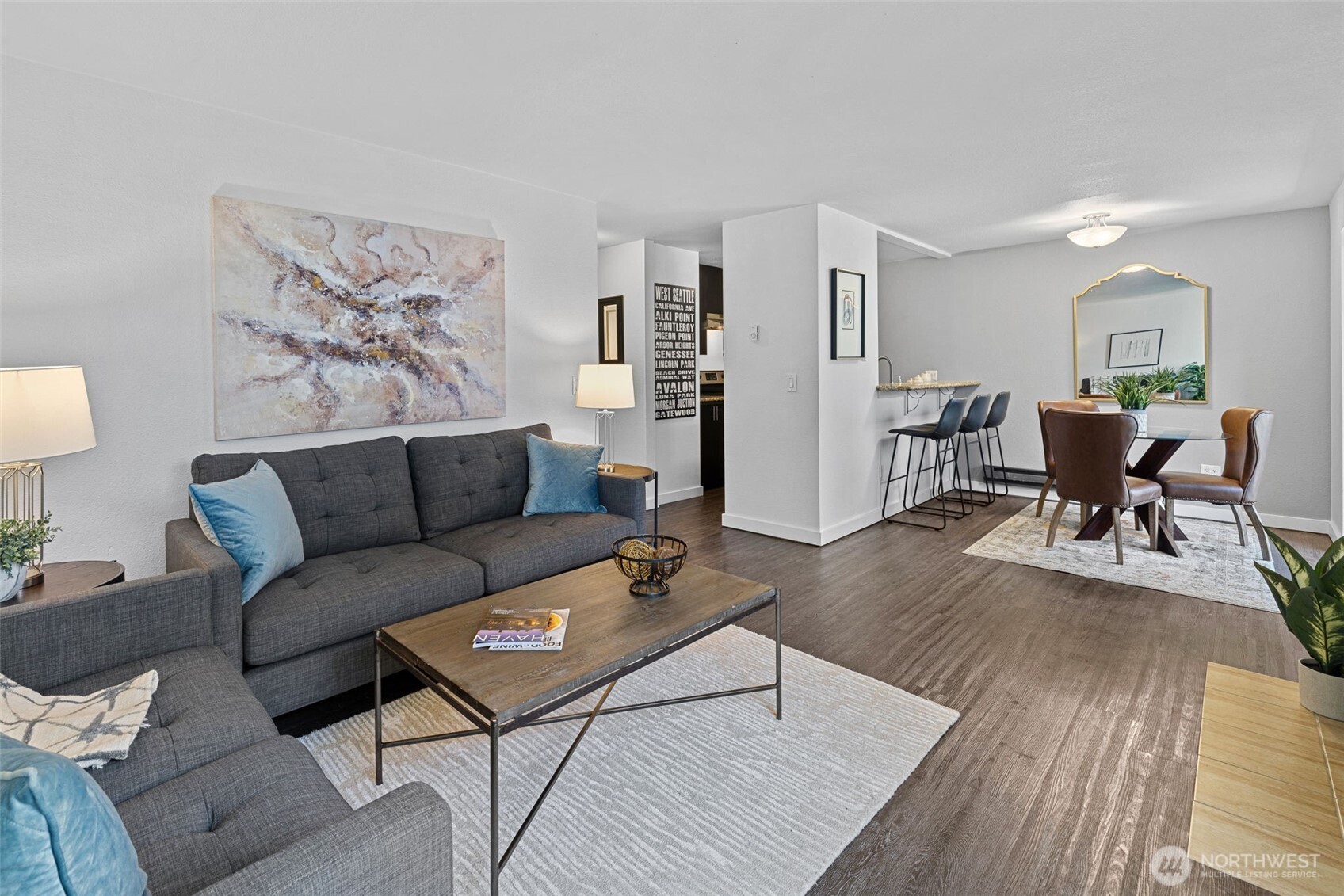 9806 28th Avenue Southwest, Unit A104 Seattle, WA 98126 - Photo 2 of 25 a living room with furniture and wooden floor