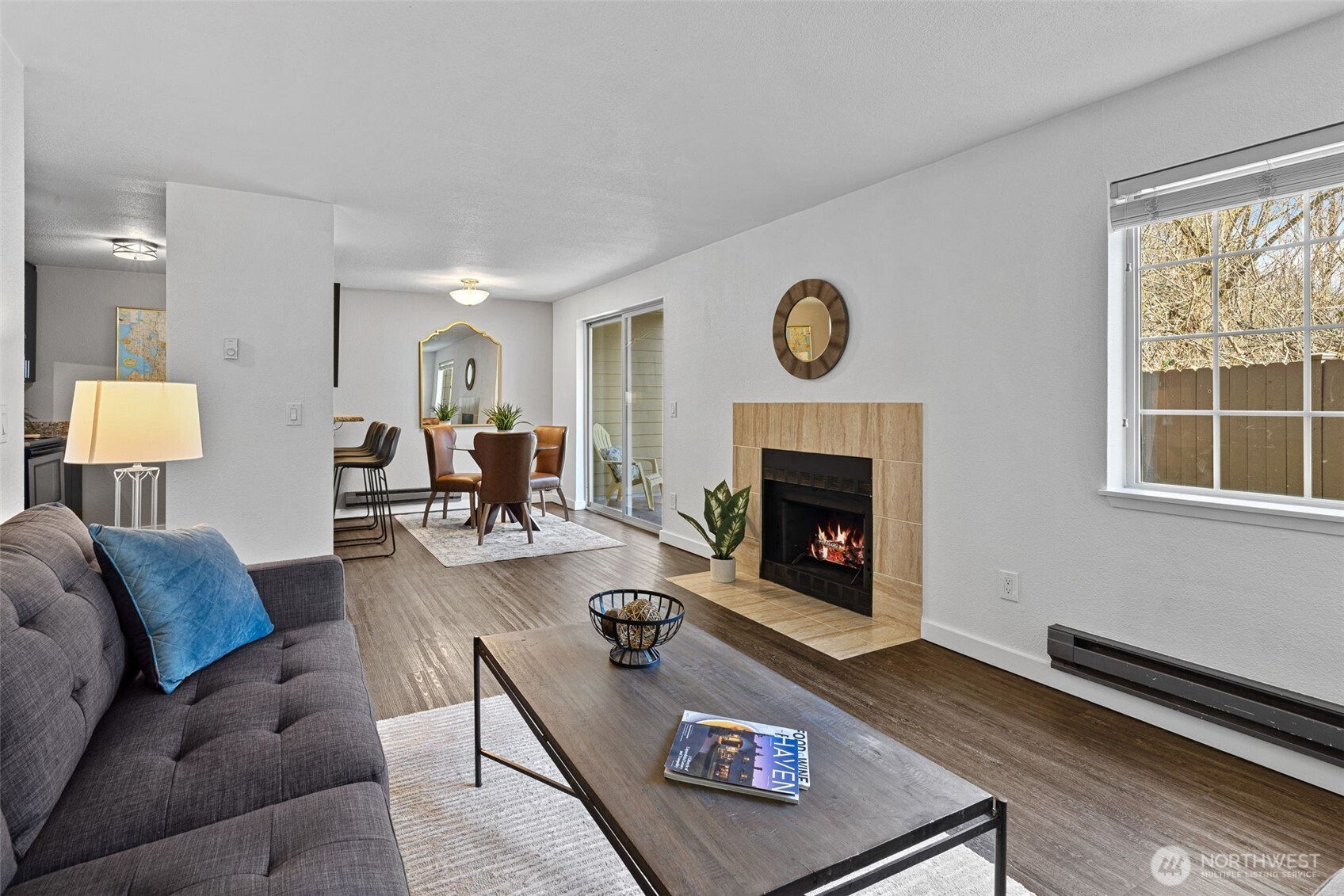 9806 28th Avenue Southwest, Unit A104 Seattle, WA 98126 - Photo 3 of 25 a living room with furniture and a fireplace