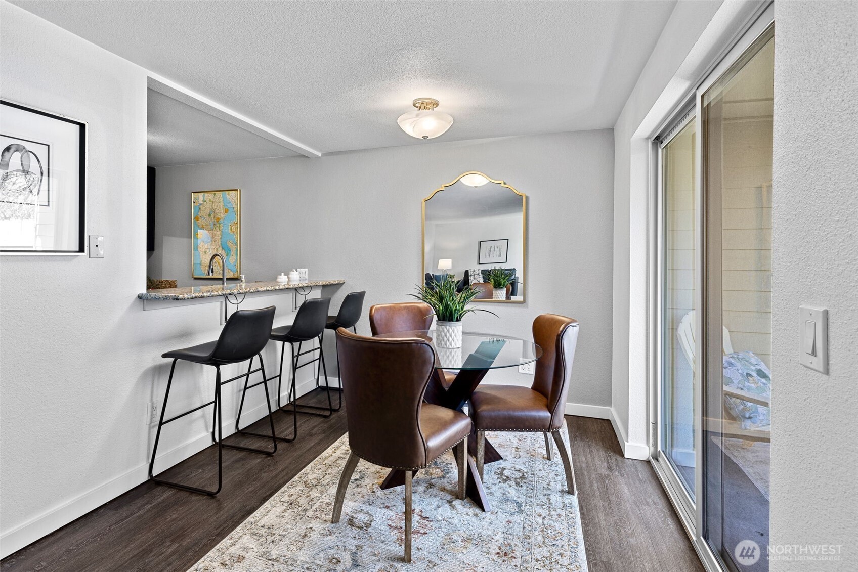 9806 28th Avenue Southwest, Unit A104 Seattle, WA 98126 - Photo 6 of 25 a view of a dining room with furniture and a window