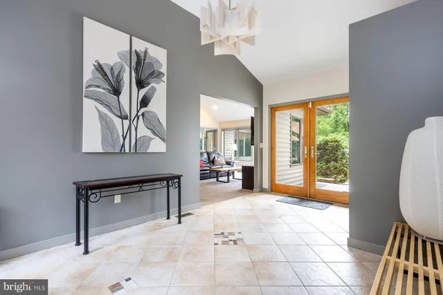 a view of a livingroom with furniture and a window