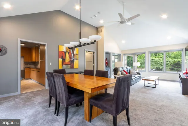 a dining room with furniture and window