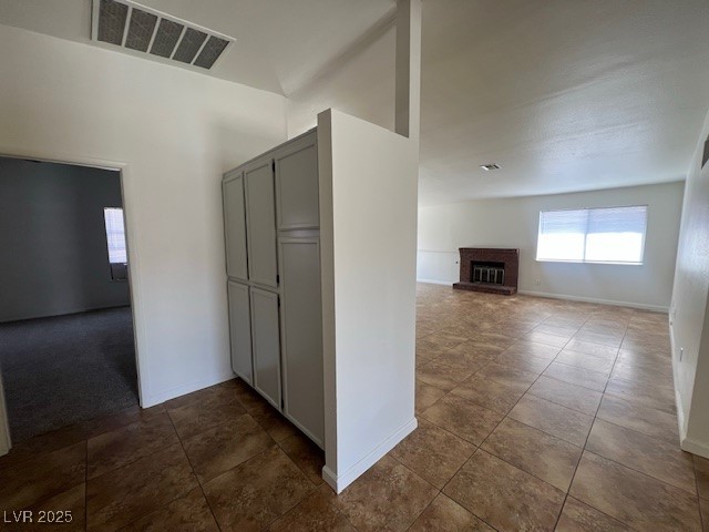 1117 Grillo Way Boulder City, NV 89005 - Photo 9 of 19 Hall with baseboards, visible vents, and dark tile