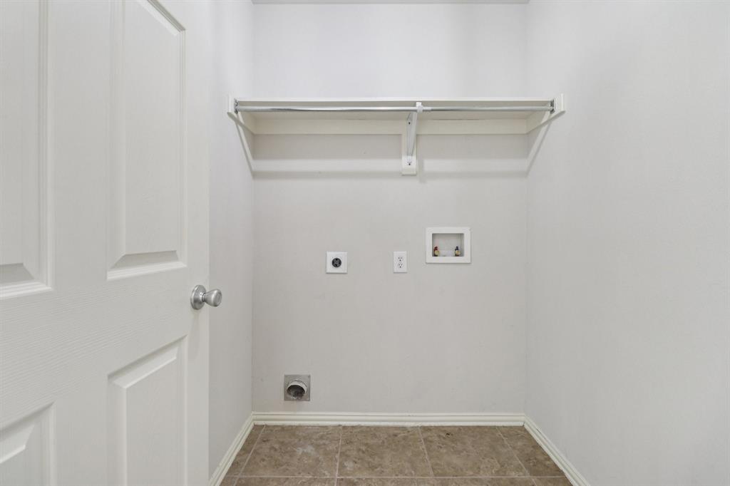588 Louder Way Fate, TX 75087 - Photo 15 of 34 Laundry room with electric dryer hookup, hookup for a washing machine, and light tile patterned flooring