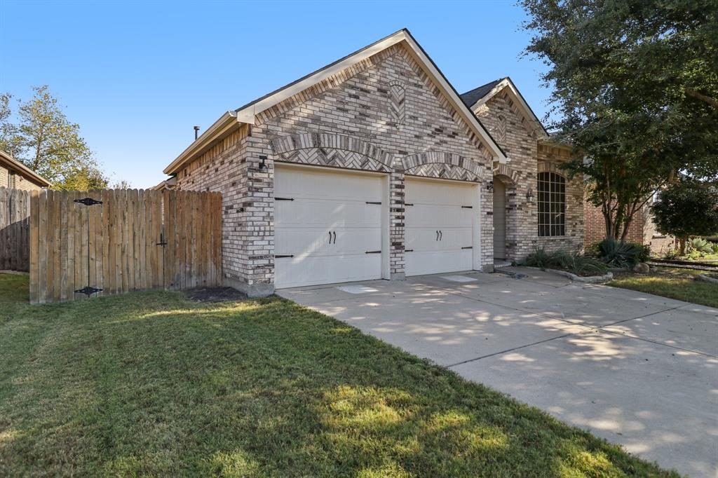 588 Louder Way Fate, TX 75087 - Photo 2 of 34 View of front of home featuring brick siding, concrete driveway, and an attached garage