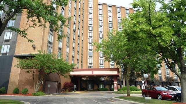 1 Renaissance Place, Unit 915 Palatine, IL 60067 - Photo 11 of 11 a front view of a building with trees