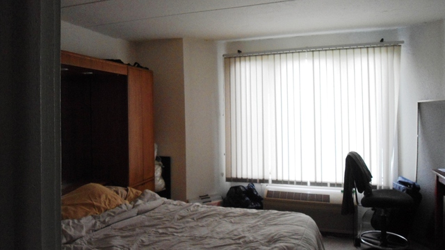 1 Renaissance Place, Unit 915 Palatine, IL 60067 - Photo 7 of 11 a bedroom with a bed and a window