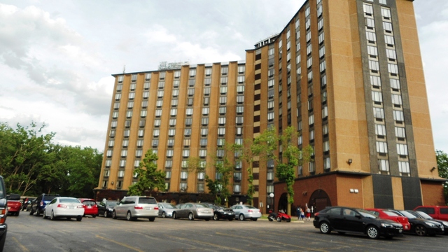 1 Renaissance Place, Unit 915 Palatine, IL 60067 - Photo 9 of 11 a city street lined with parked cars