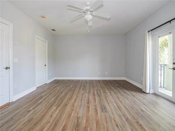 wooden floor in an empty room with a window