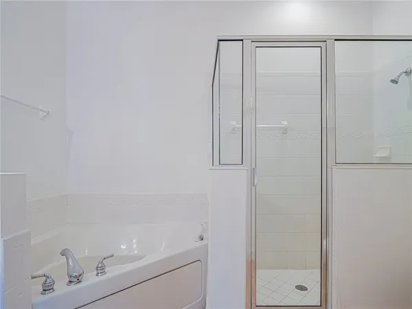 a bathroom with a shower and a sink