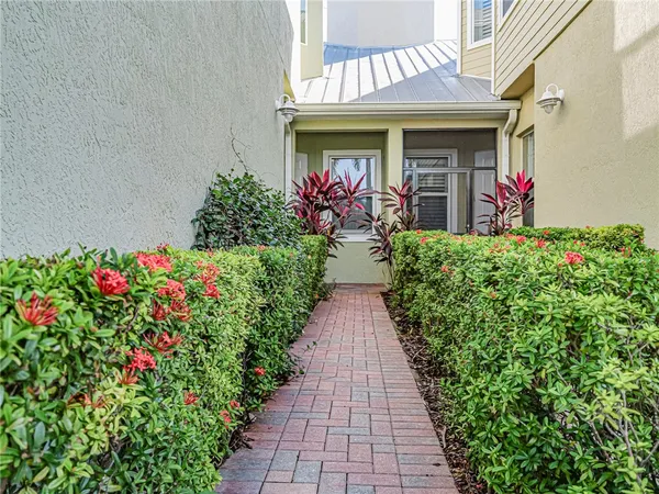 a view of a house with flower pots
