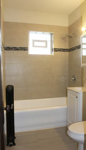 a bathroom with a shower and a bathtub