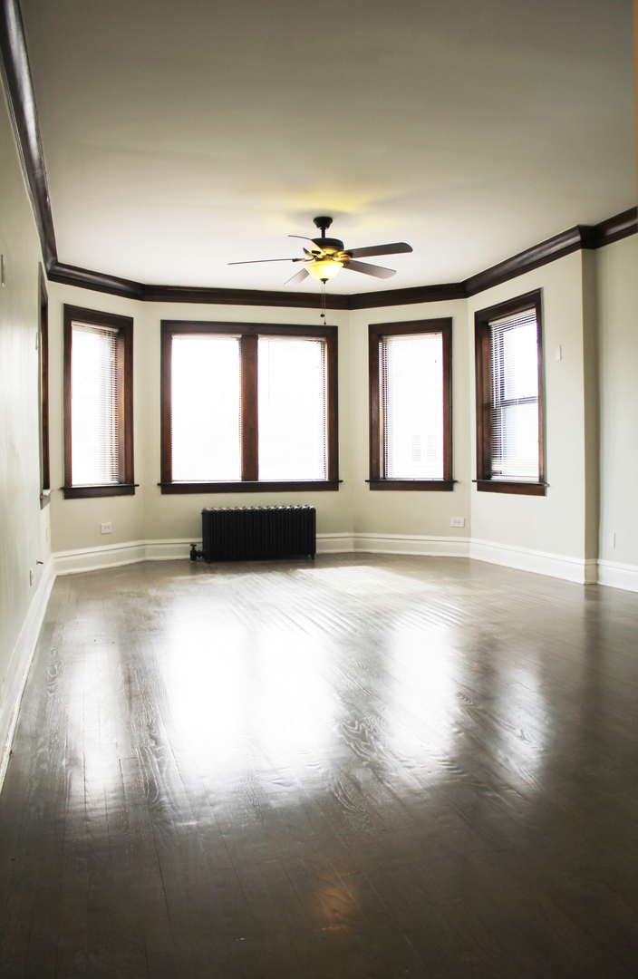 6 West 111th Place Chicago, IL 60628 - Photo 10 of 18 an empty room with windows and entrance