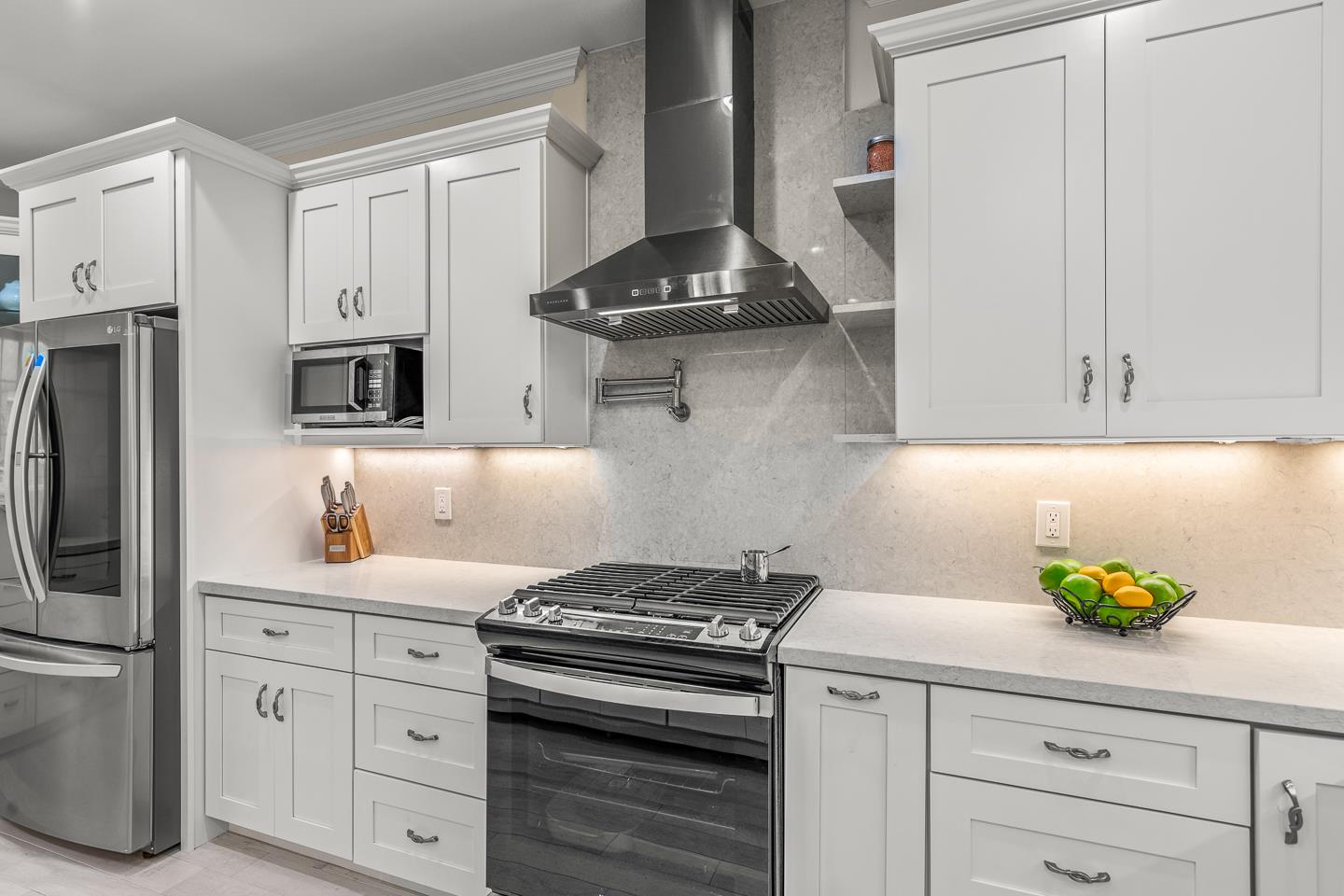 1011 Prospect Heights Santa Cruz, CA 95065 - Photo 14 of 50 a kitchen with stainless steel appliances a stove a refrigerator and cabinets