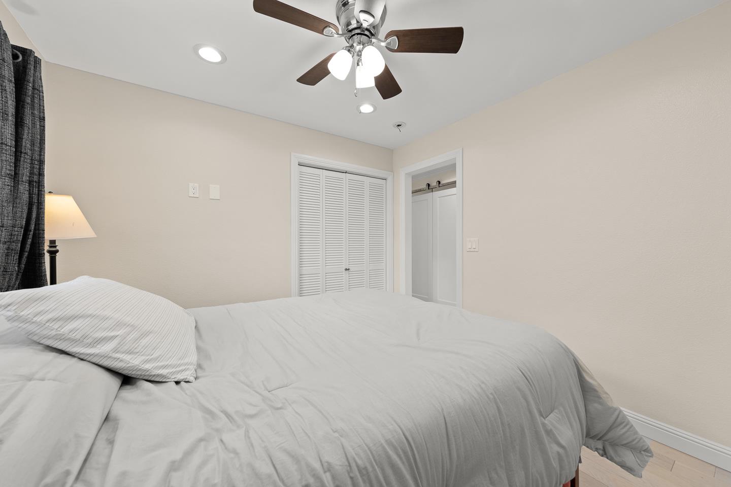 1011 Prospect Heights Santa Cruz, CA 95065 - Photo 28 of 50 a bedroom with a large bed and a chandelier