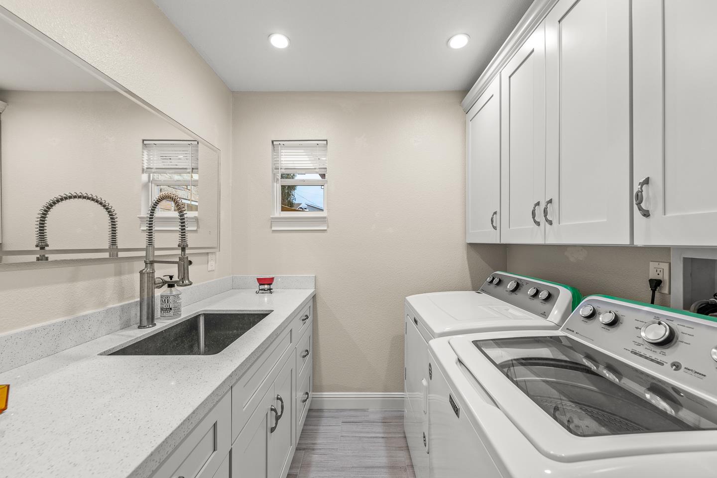 1011 Prospect Heights Santa Cruz, CA 95065 - Photo 35 of 50 a kitchen with a sink white cabinets and white appliances