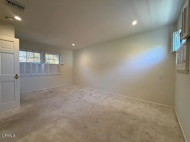 a view of a tree in front of a house