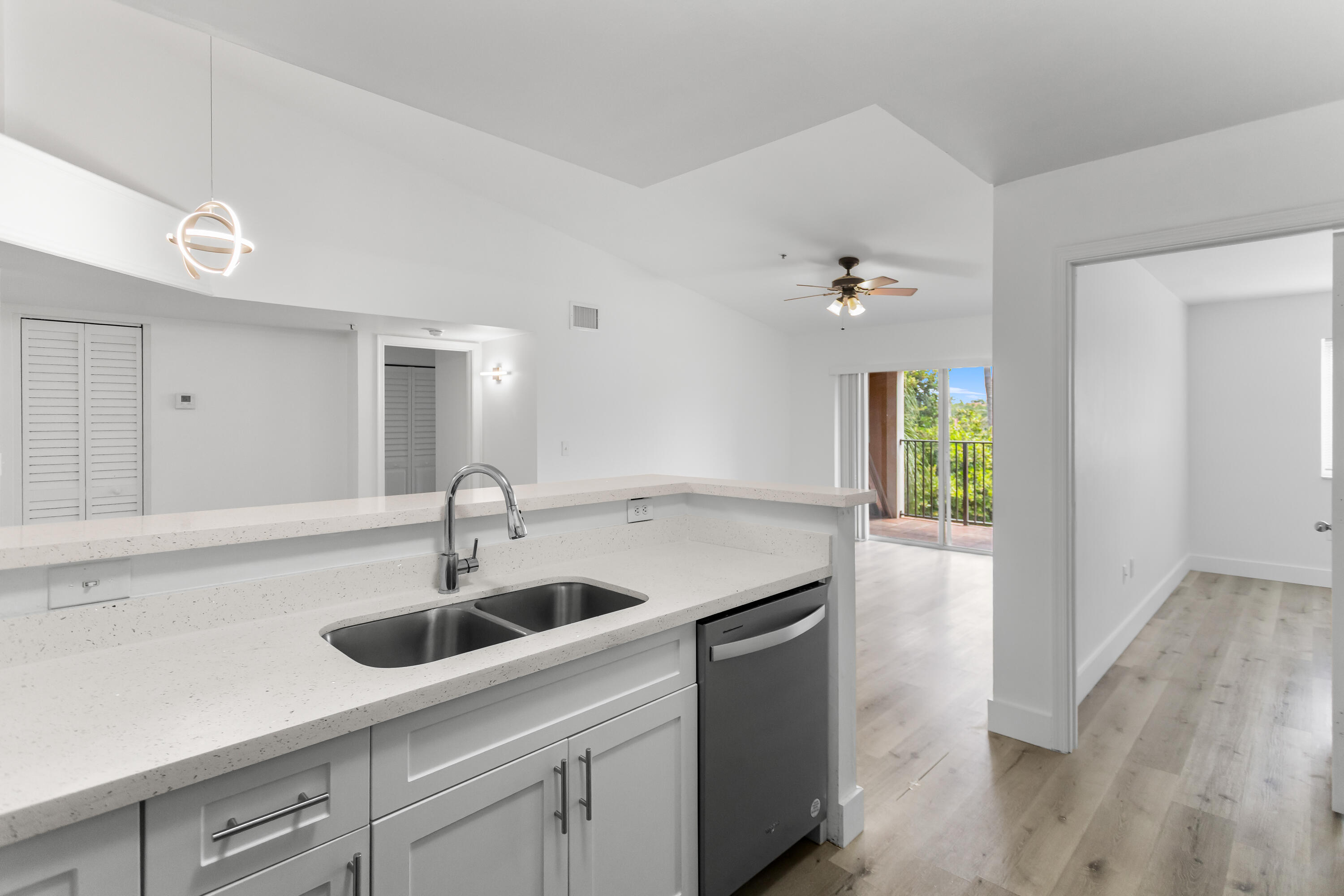 2113 Renaissance Boulevard, Unit 306 Miramar, FL 33025 - Photo 17 of 59 a kitchen with a sink and a window