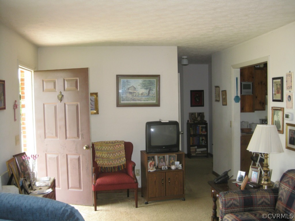 1067 Unity Road Kenbridge, VA 23944 - Photo 12 of 21 a living room with furniture a lamp and a window